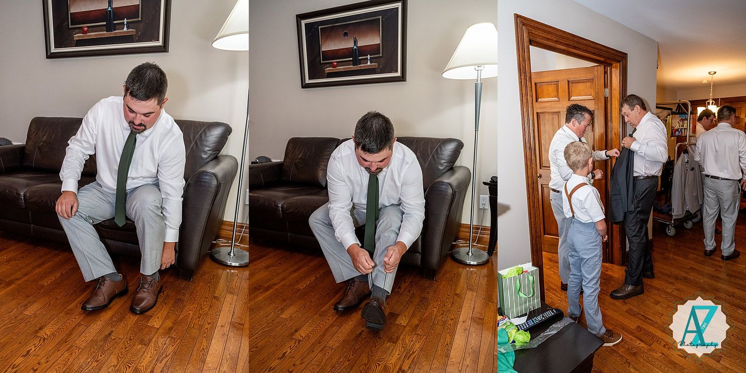 Professional carpet cleaners in white uniforms methodically working on cleaning a brown carpeted floor area.