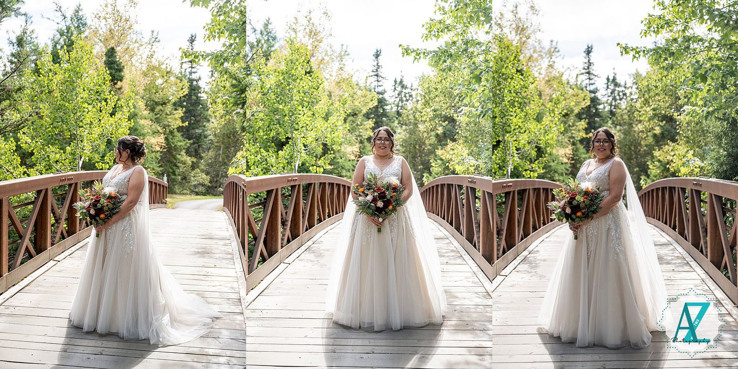 People in white dresses gather on a wooden bridge at an outdoor venue during a special celebration.