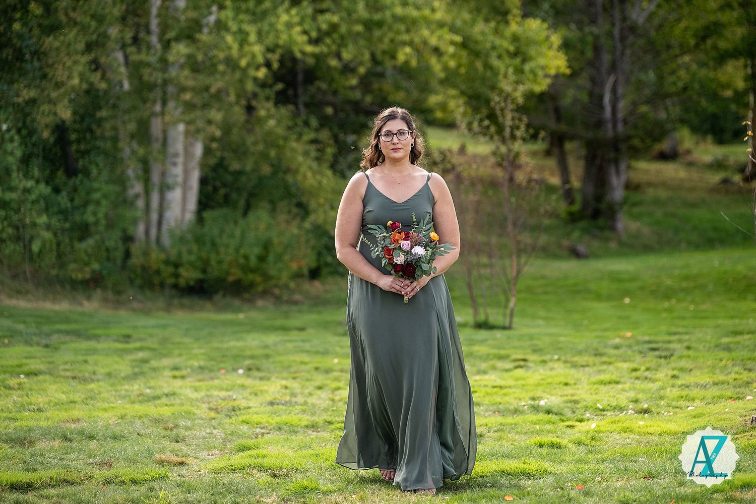 A romantic outdoor portrait session captures a couple in soft natural lighting surrounded by greenery.