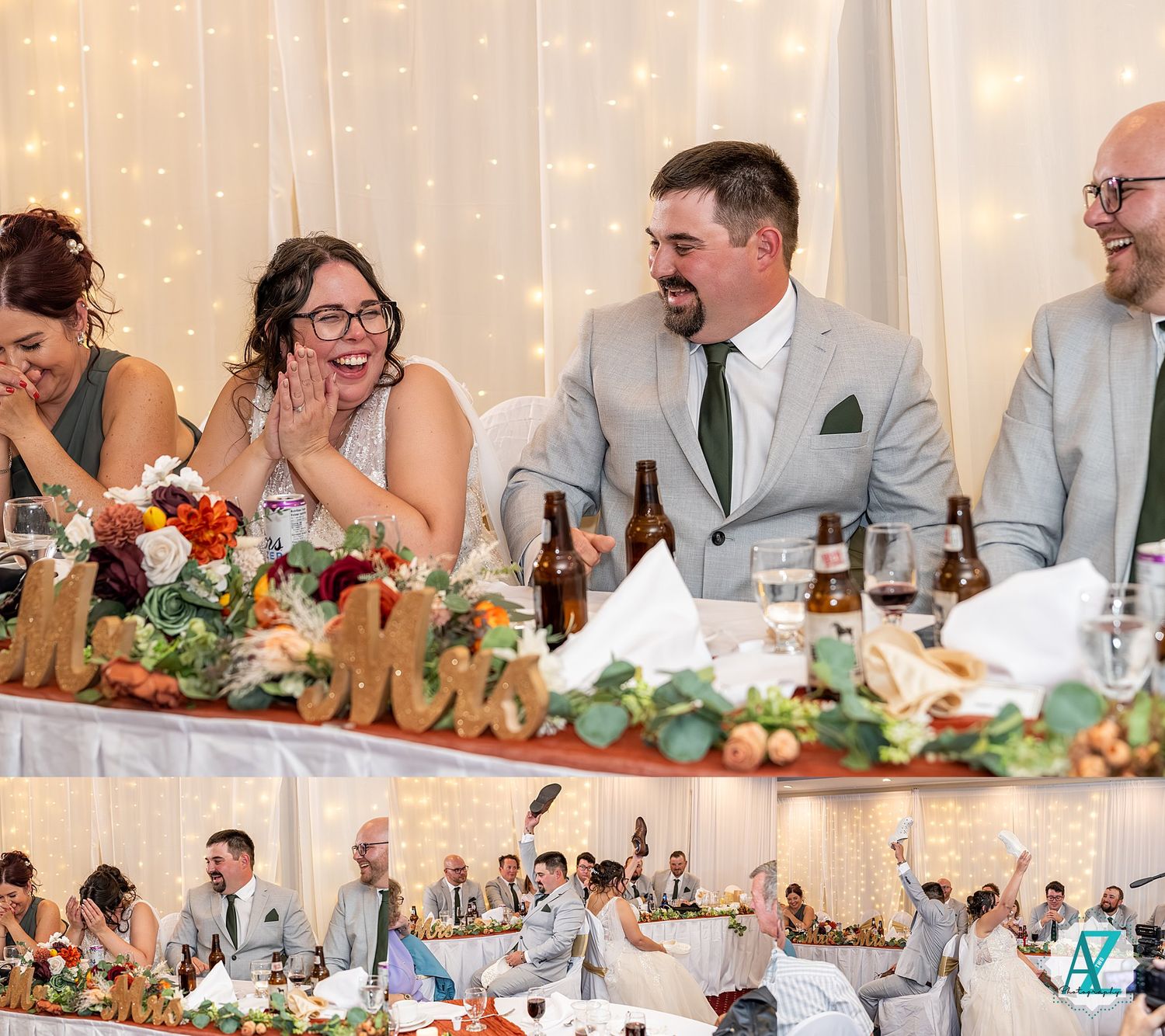 Wedding party laughs together at reception table decorated with floral centerpieces and string lights.
