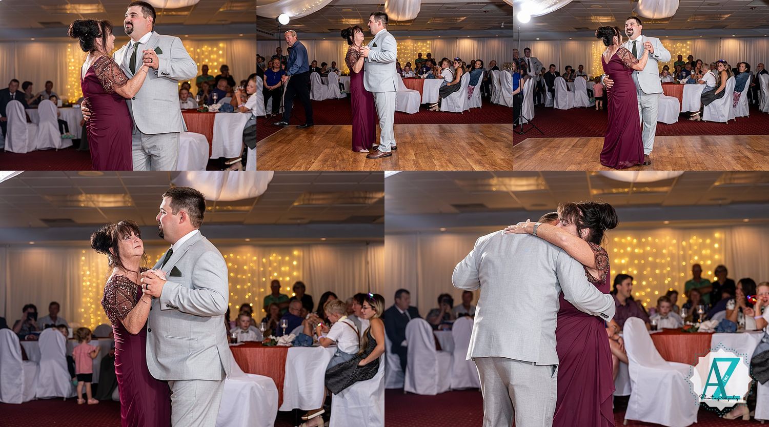 Multiple couples slow dancing on a ballroom floor at a wedding reception with burgundy decor.