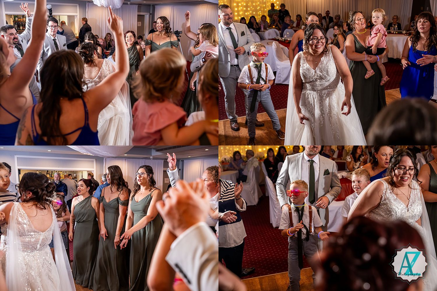 Large group of party guests enjoying themselves while dancing at a wedding reception with uplighting.