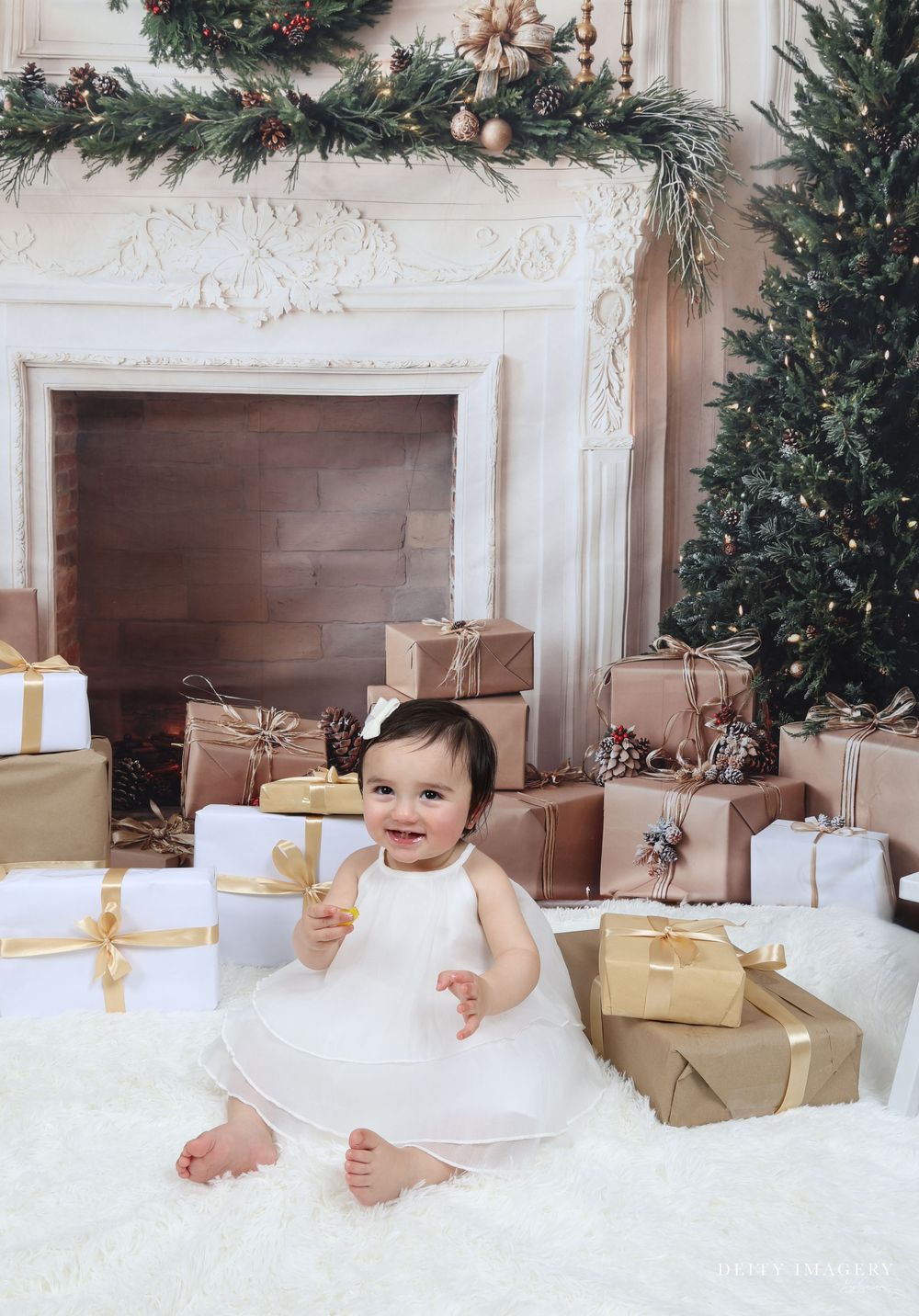 A festive holiday scene with evergreen trees, wrapped presents, and elegant white decor against an ornate fireplace mantel.