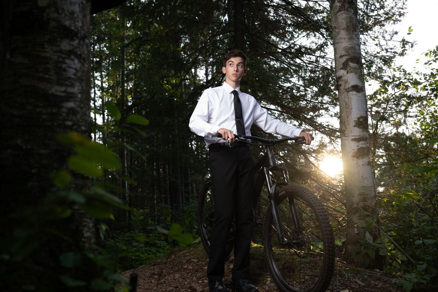 Senior Grad Pictures, male in suit with bike, Carlton Minnesota