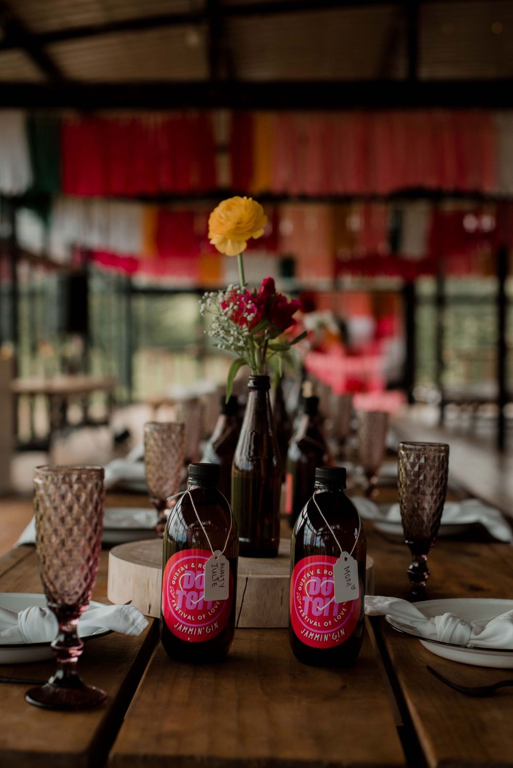 A vibrant pink festival setup with thoughtful homemade drinks for every guest, bringing color and joy to the celebration.