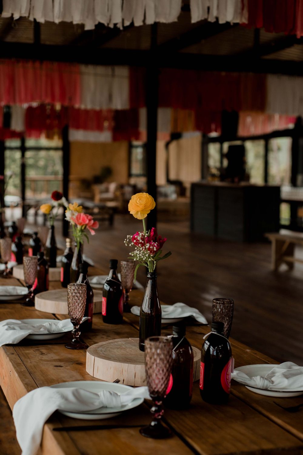 A vibrant pink festival setup with thoughtful homemade drinks for every guest, bringing color and joy to the celebration.