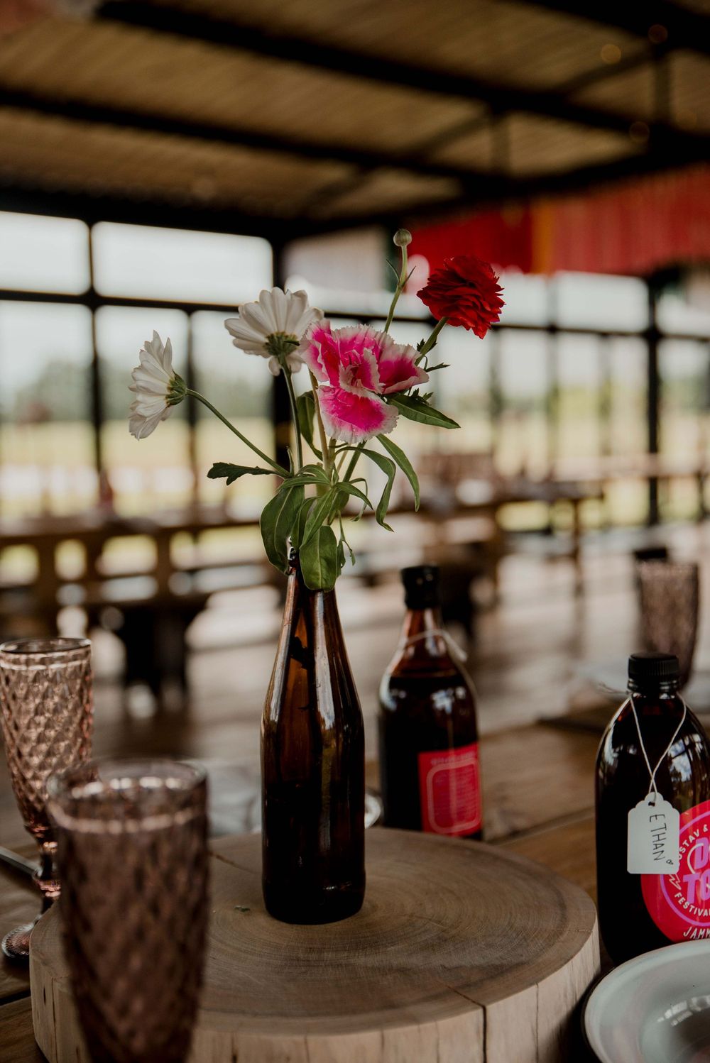 A vibrant pink festival setup with thoughtful homemade drinks for every guest, bringing color and joy to the celebration.
