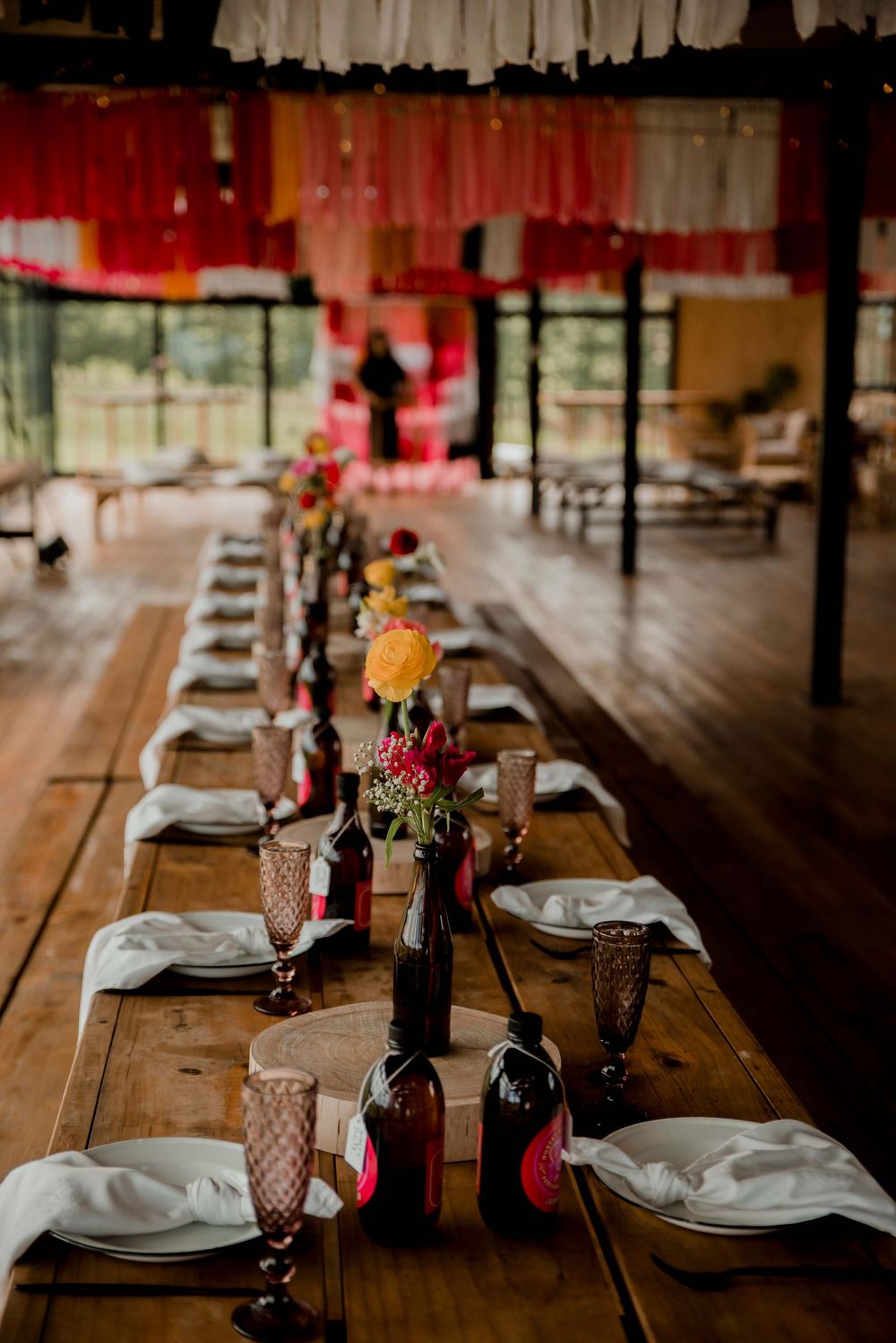 A vibrant pink festival setup with thoughtful homemade drinks for every guest, bringing color and joy to the celebration.