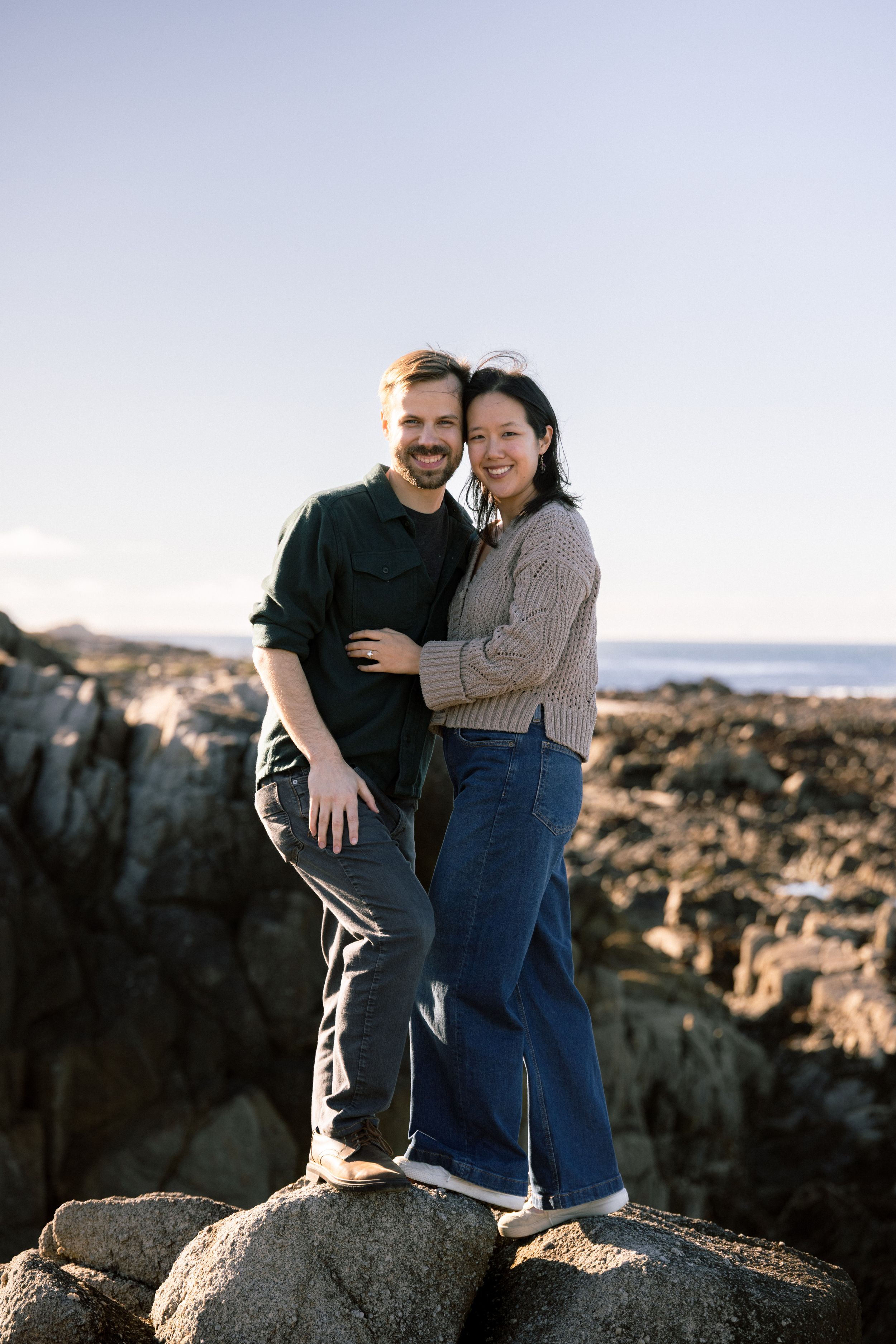 Point Pinos engagement portraits along rocky coastline
