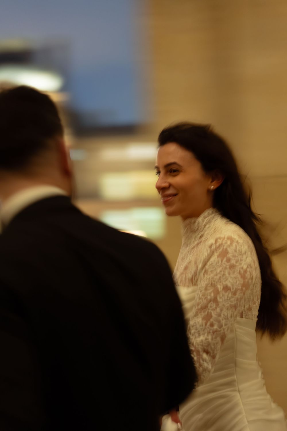 A smiling bride in a white lace high-neck gown. Paris at midnight wedding, paris cinematic wedding photography, day to night paris wedding