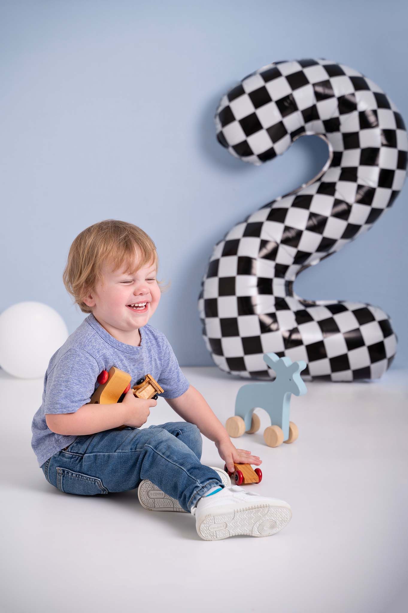 two year old second birthday photos in race car theme and checkered two balloon Baltimore, Ontario*