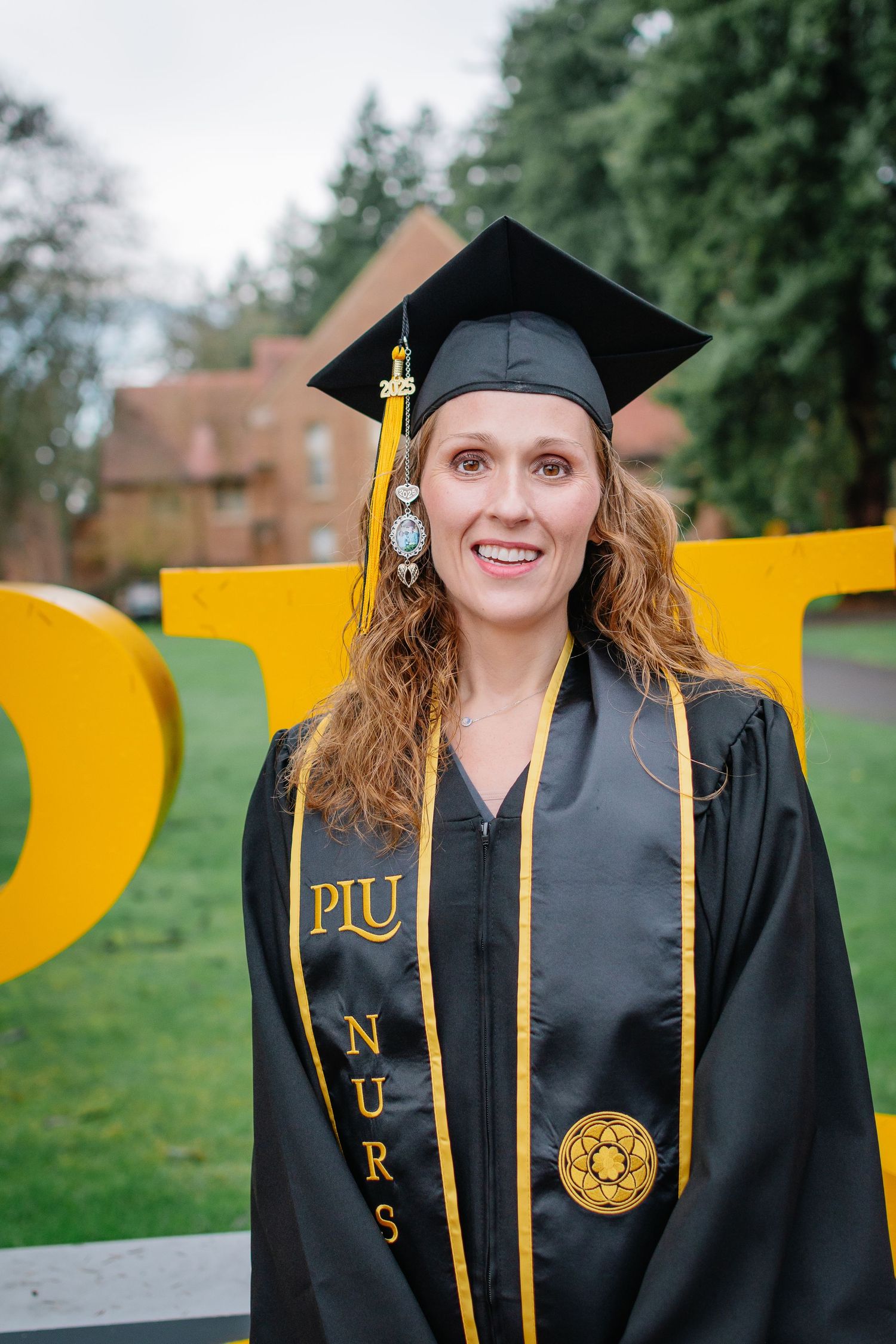 PLU nursing graduate in Tacoma for graduation cap and gown photo.