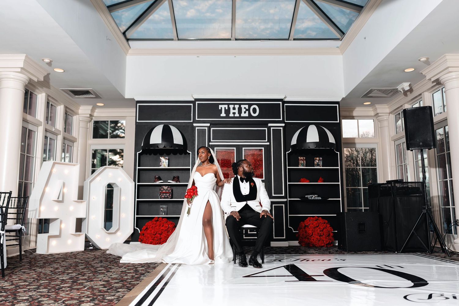 Elegant 40th birthday celebration with couple posing in front of  backdrop with large 40 marquee letters.  Deerfield Golf Club Newark De