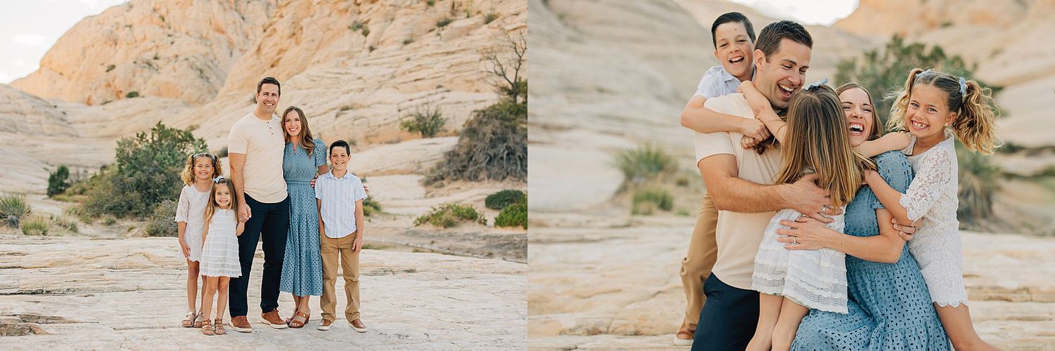 Joyful family posing and embracing in a scenic desert landscape during a professional outdoor photo shoot.