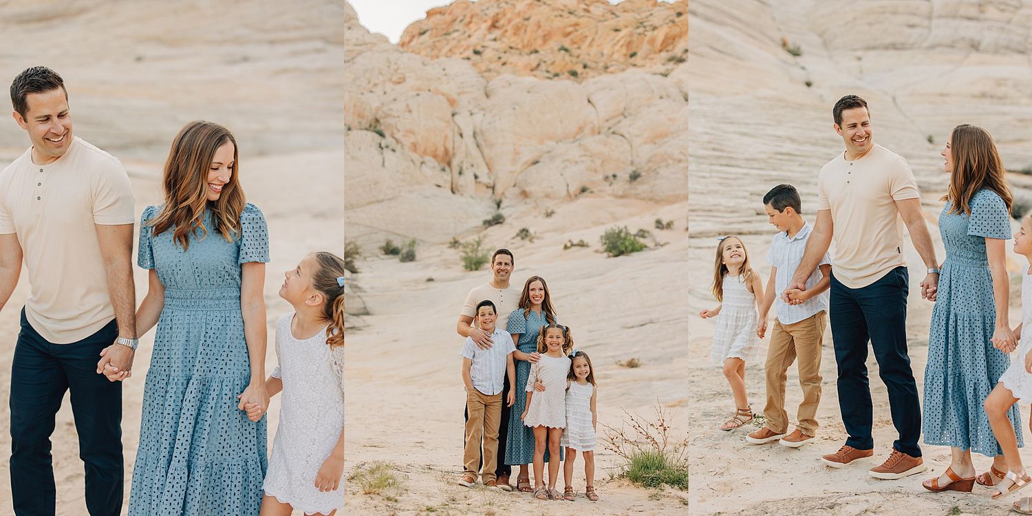 Family portrait session in a desert landscape with sandy rocks, featuring a couple and children in coordinating blue and white outfits.