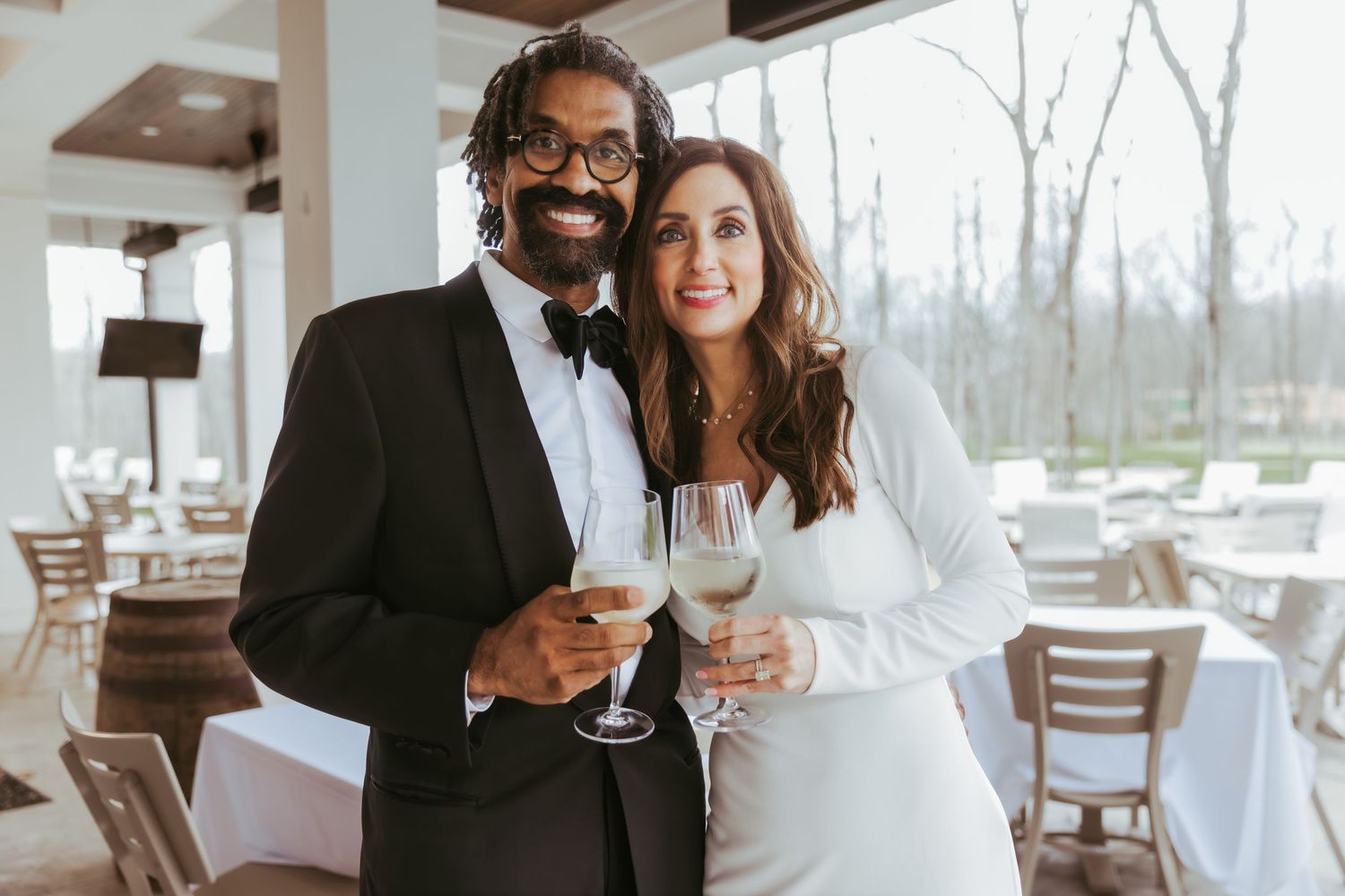 Bride and groom champagne toast for their wedding reception at Holliday Farms in Zionsville, Indiana