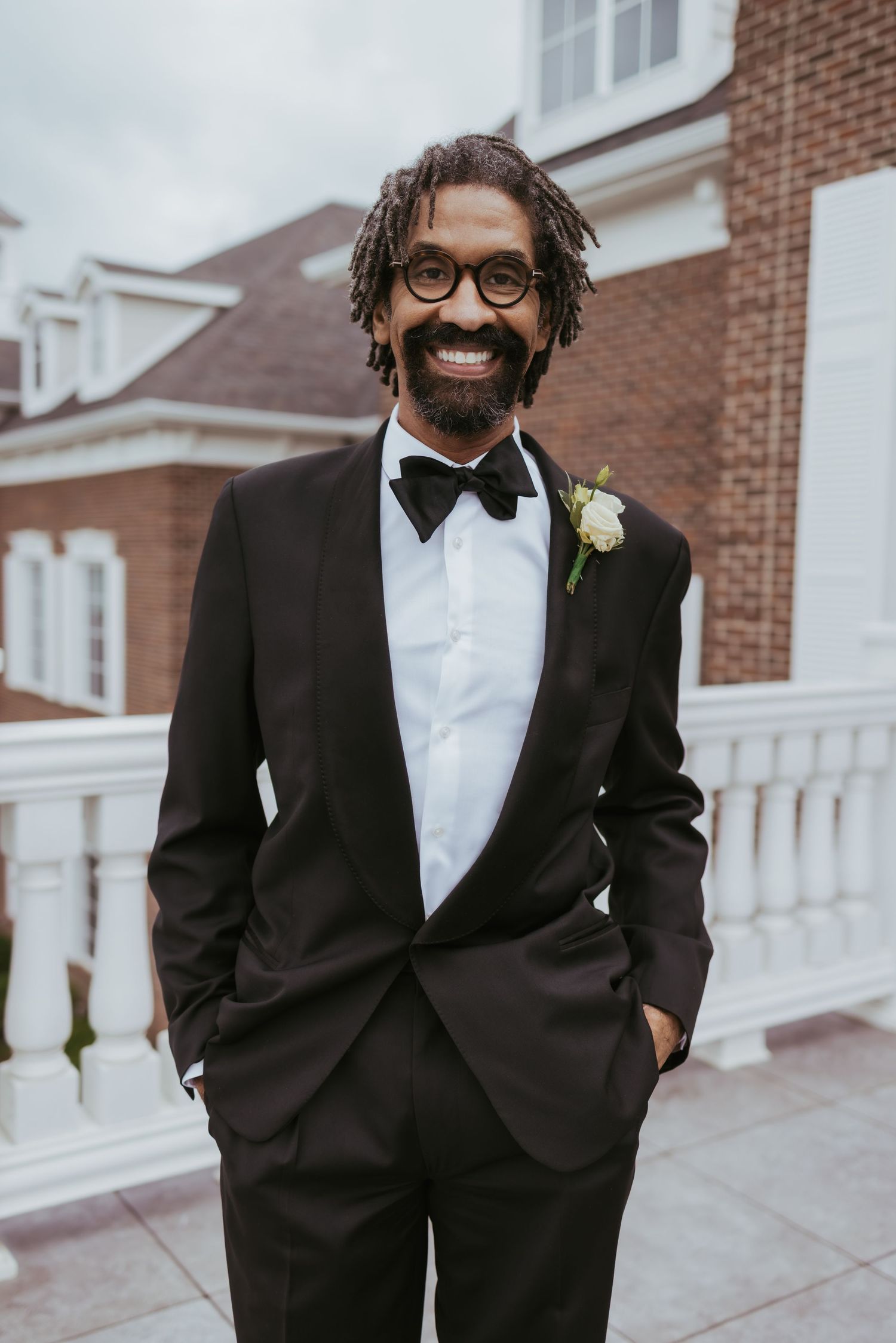 Groom portrait on a windy day after getting married at Holliday Farms in Zionsville, Indiana