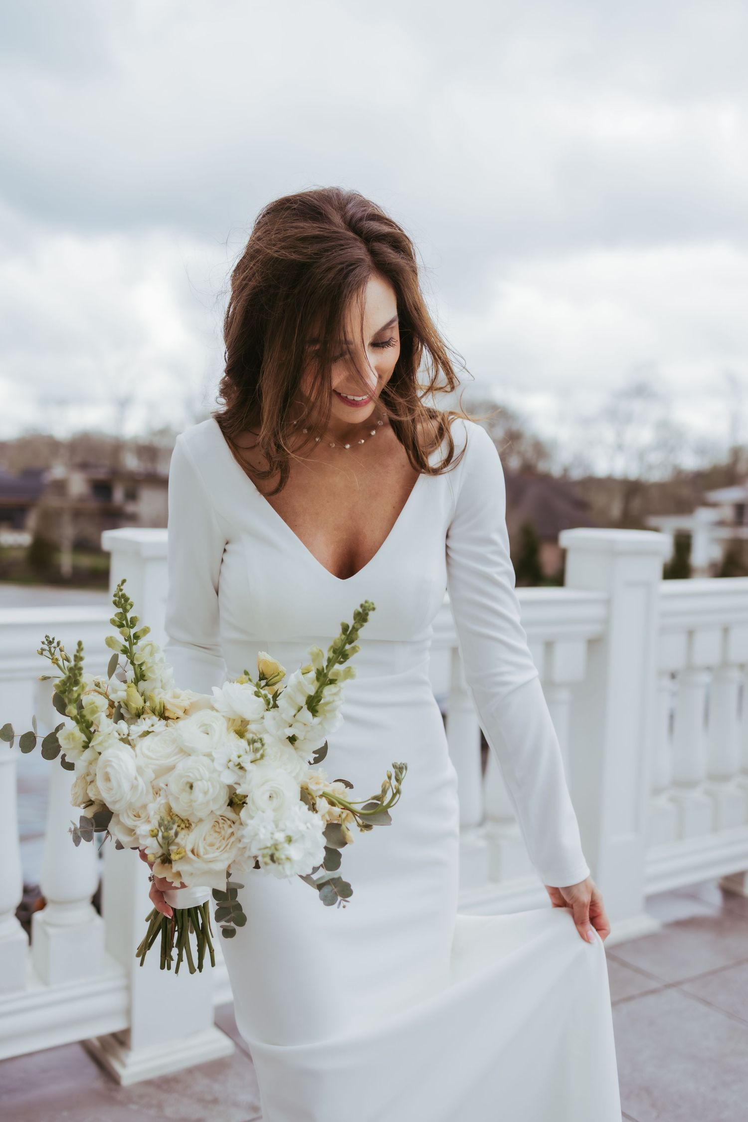 Bridal portrait on a windy day after getting married at Holliday Farms in Zionsville, Indiana