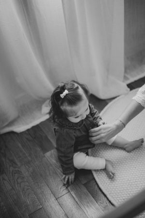 Overhead view of someone exploring patterns on a white textured surface.