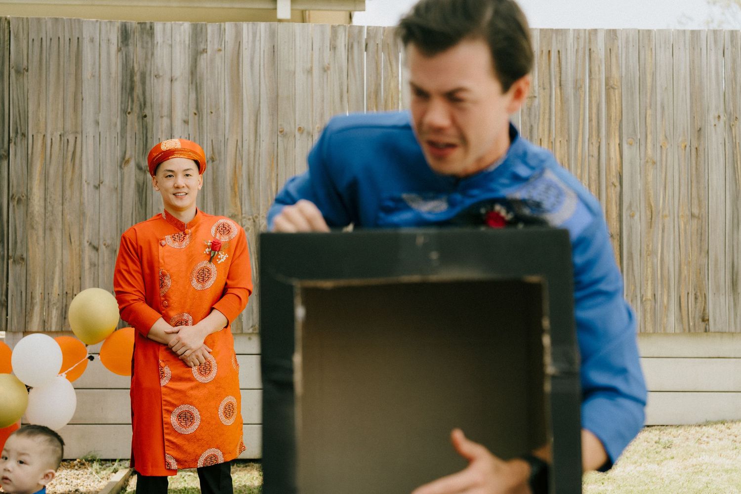 Groomsman plays game in tea ceremony