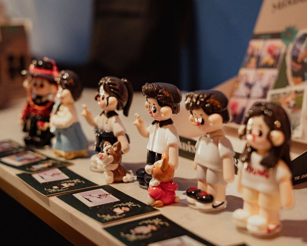 Collection of cute cartoon figurines arranged in a display line.