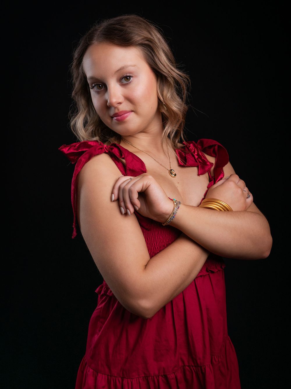 Photo of high school senior girl in red dress photographed by senior portrait photographer in Jefferson County TN