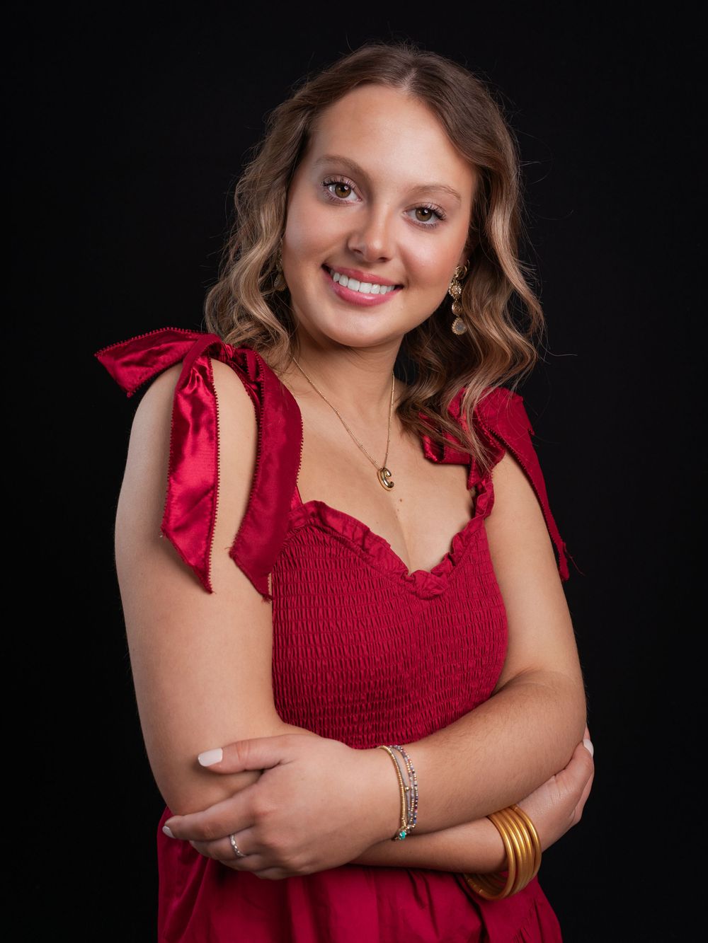 Photo of high school senior girl in red dress photographed by senior portrait photographer in Jefferson County TN