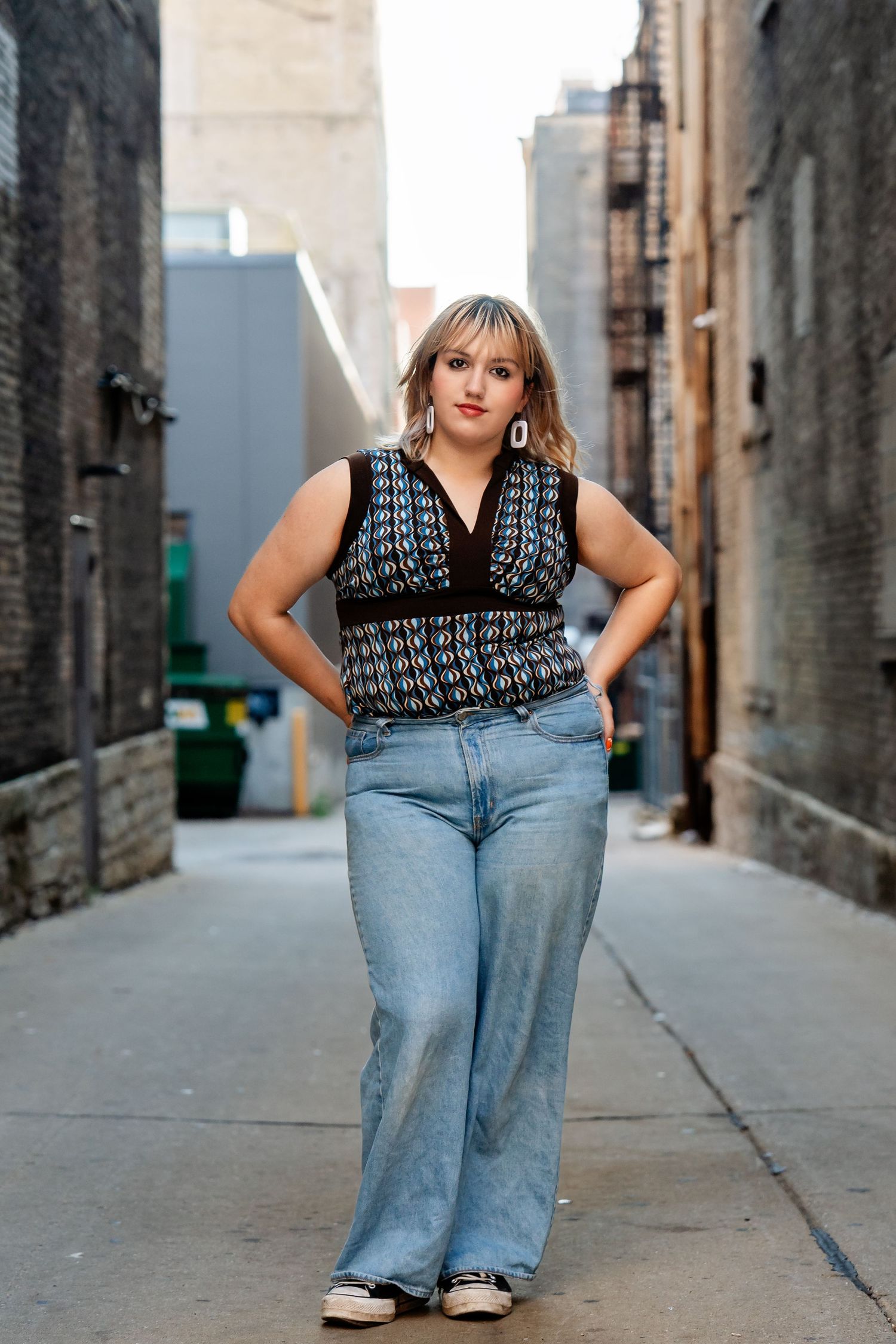 Photo of a senior in a backlit alley taken by Milwaukee senior photographer Rachel Dickman.