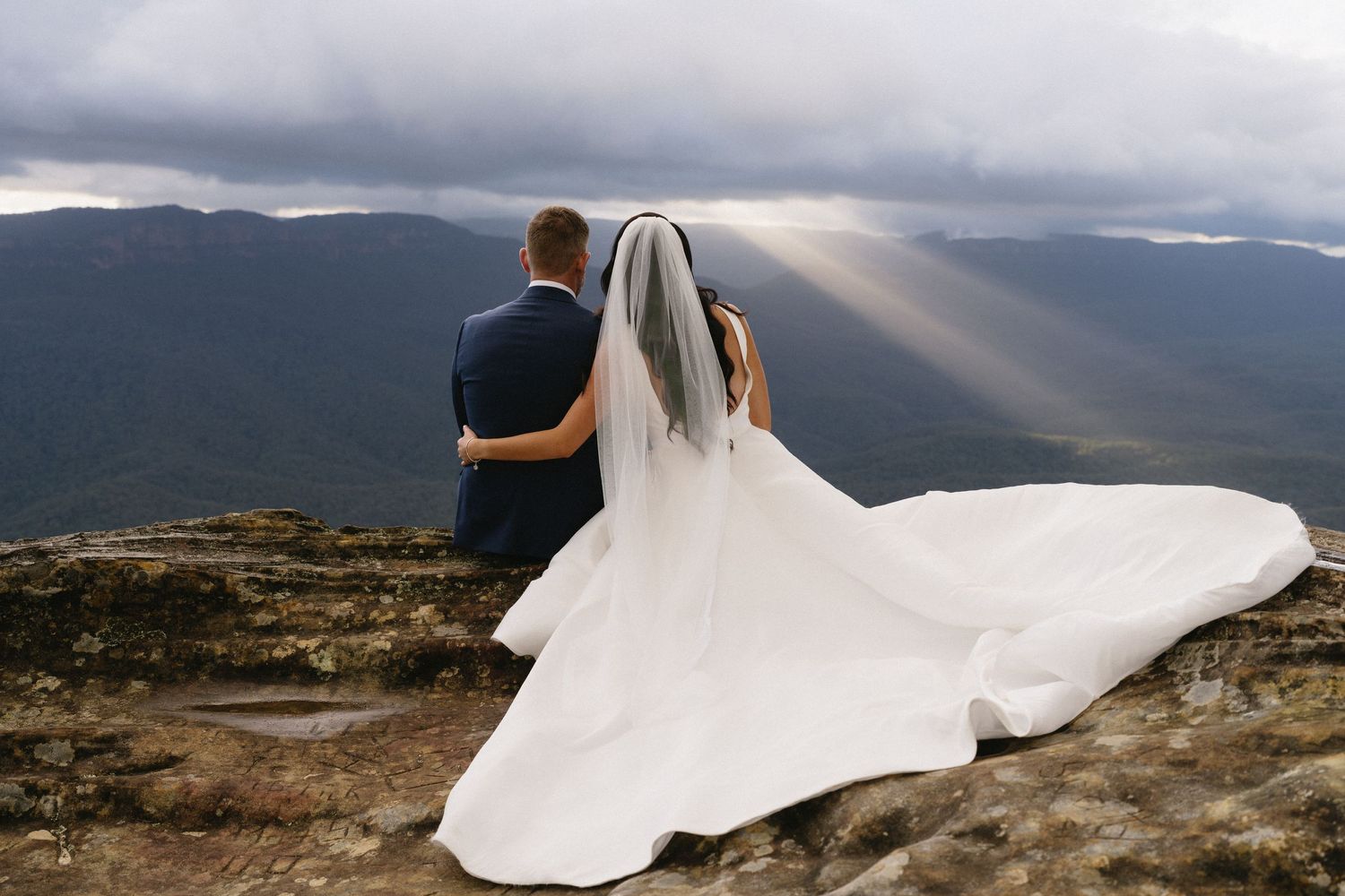 Gorgeous light peeking through the clouds for Isabella & Peter during their post-ceremony portraits in the Blue Mountains, NSW