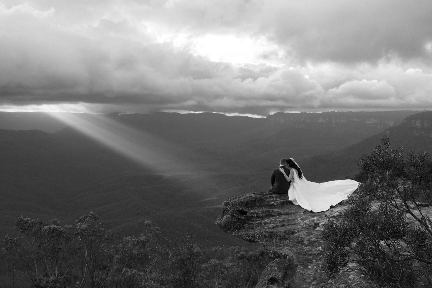 Isabella & Peter embracing after their romantic and intimate ceremony on a cliff in the Blue Mountains NSW