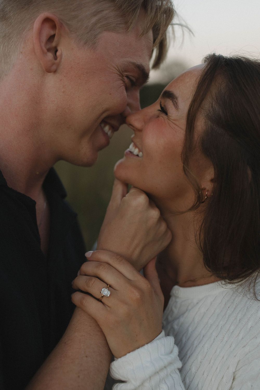Close up of couple sharing an intimate moment with soft natural lighting.