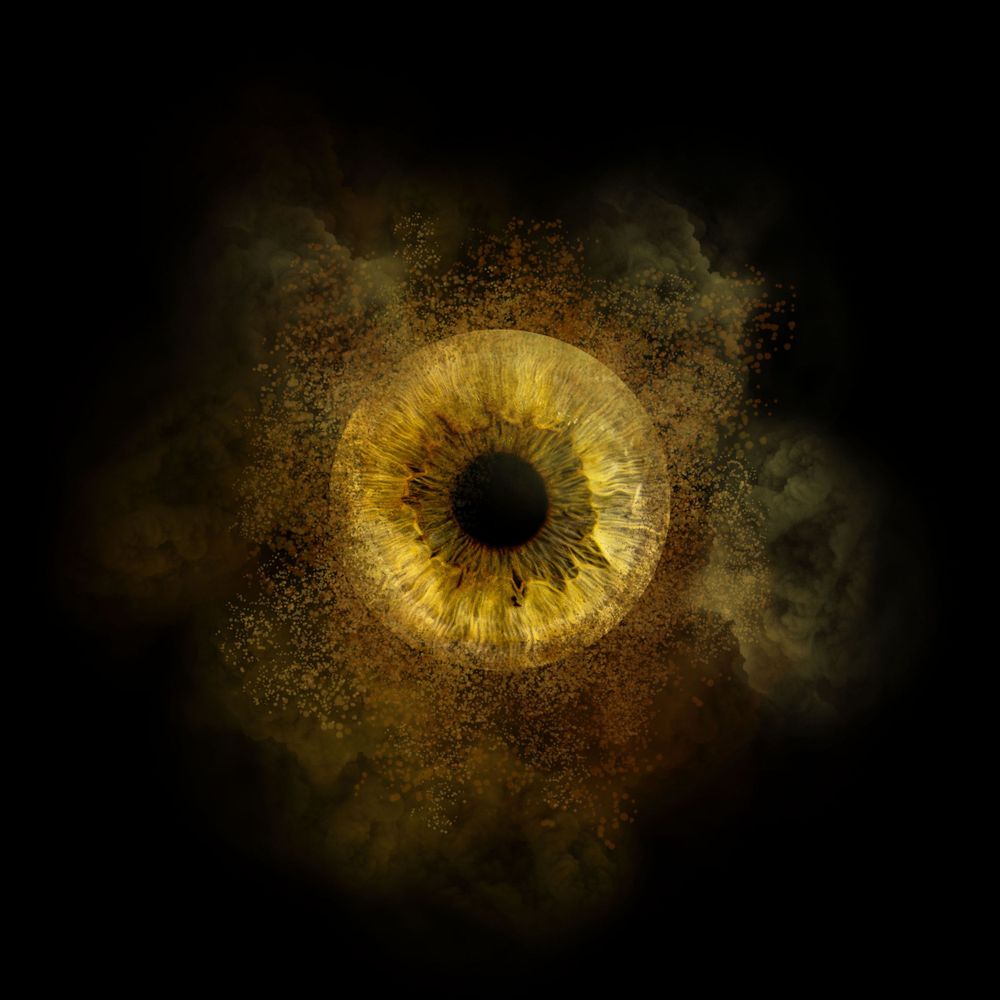 A glowing golden iris and black pupil emerges from a dark smoky background with mystical ethereal effects.