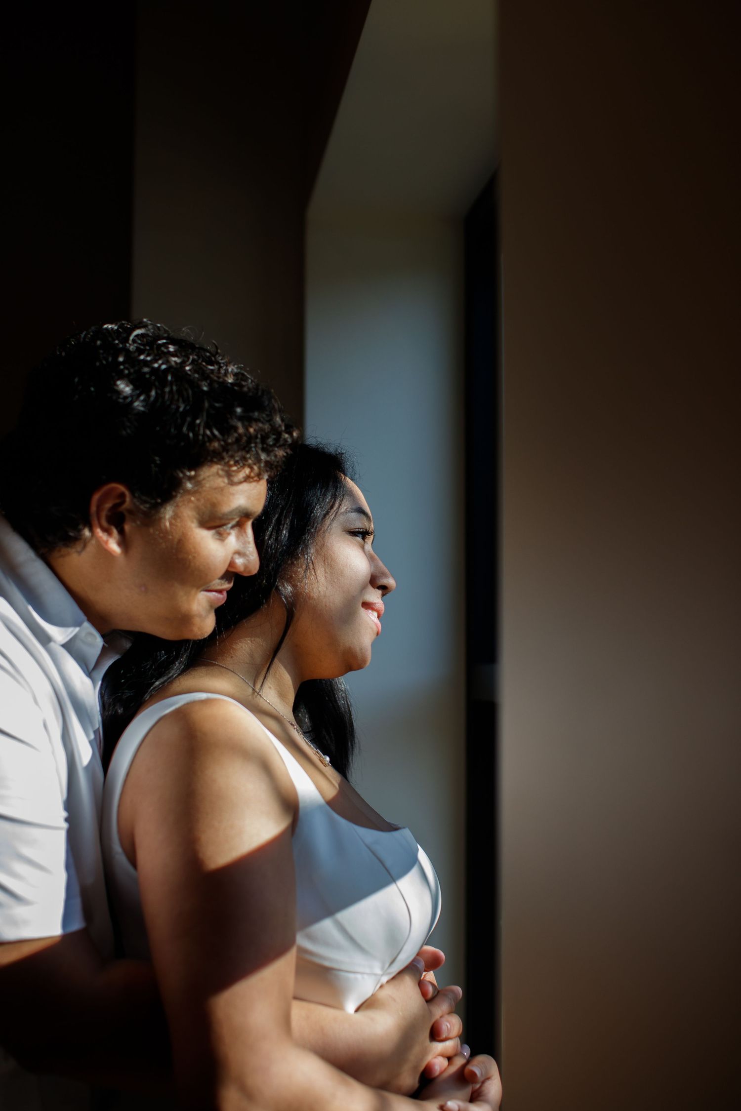 bride and groom posing idea moody light wedding
