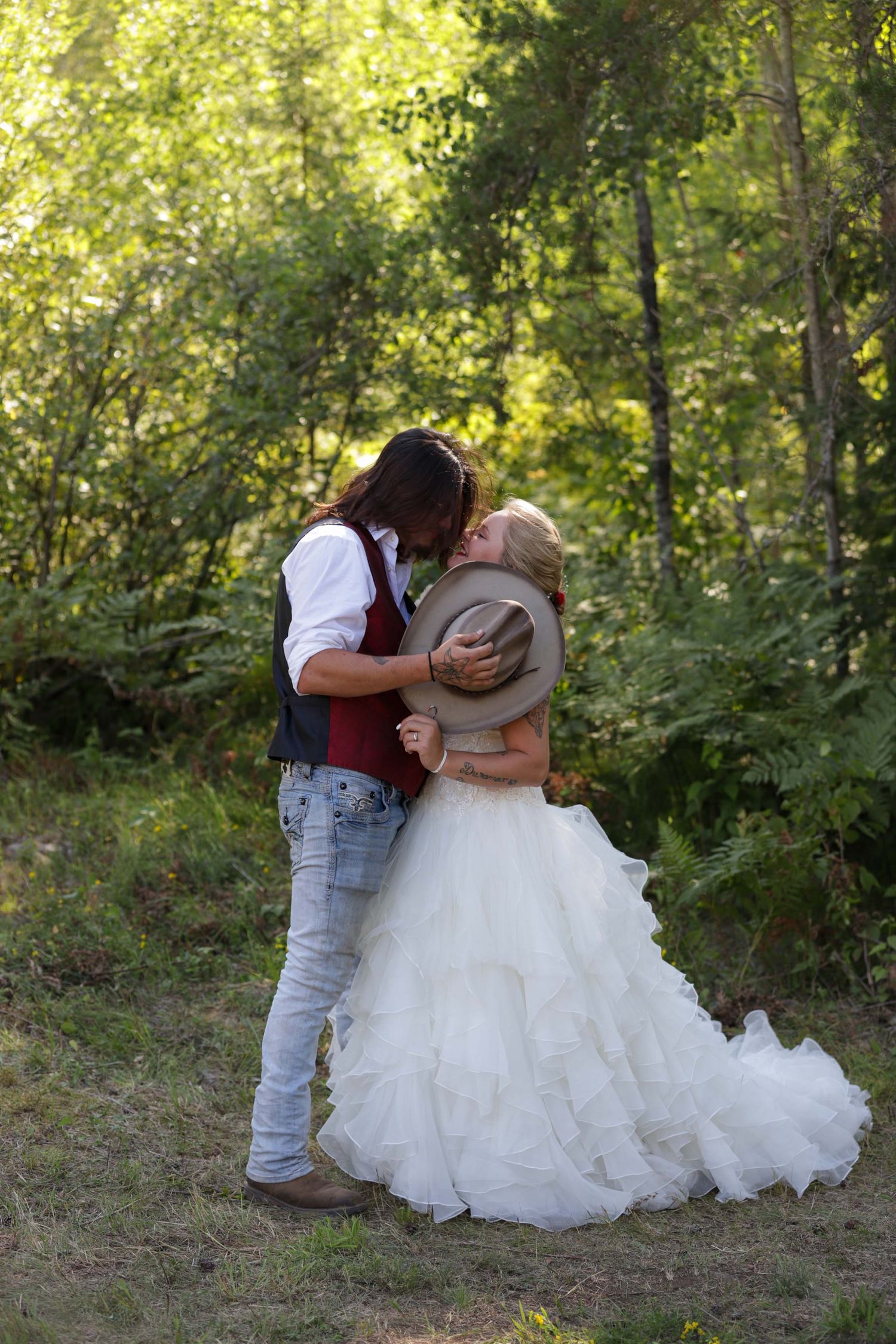 A romantic wedding day kiss .