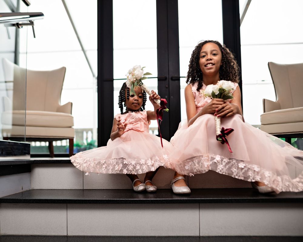 A series of photos showing someone in a pink tulle dress sitting and posing on a window ledge in natural light.