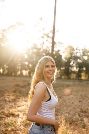 A series of sunset portraits captured in a golden field with warm backlighting and natural outdoor setting.
