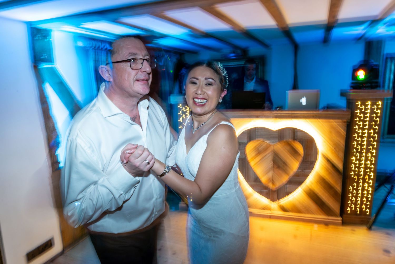 Dance floor action photograph of a bride and groom during their wedding reception at The Plough Inn, Eaton by Michael Pardoe, Runcorn