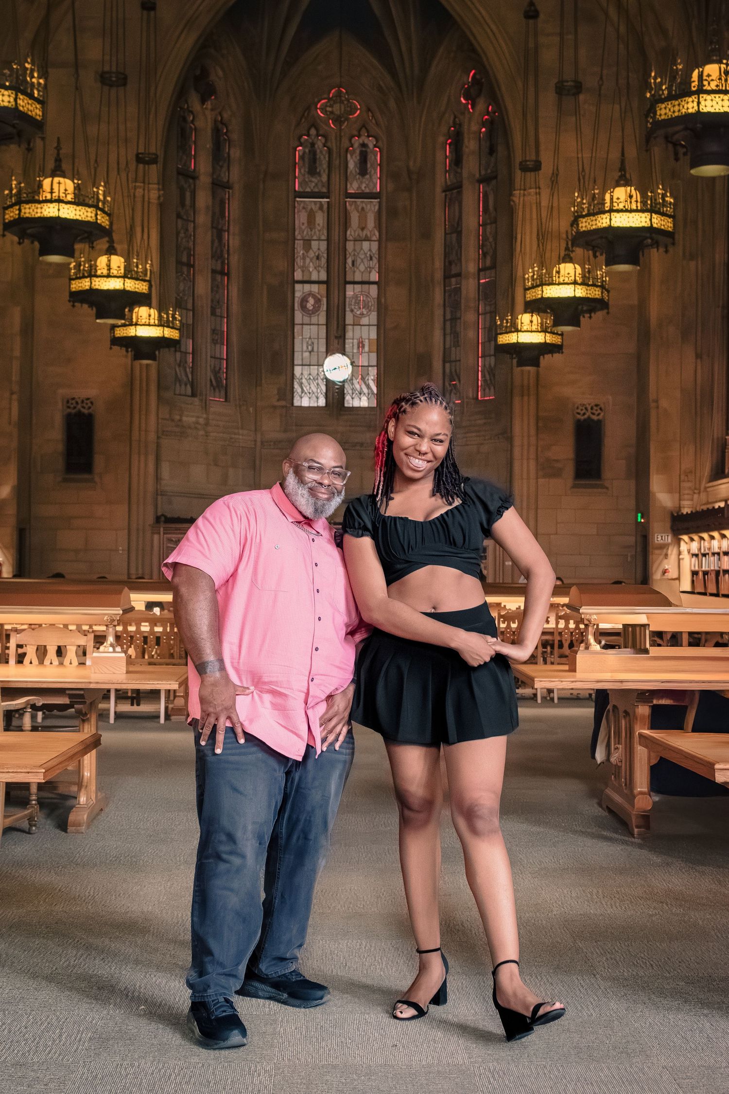 High school senior with parents during photo session at Suzzallo Library Seattle