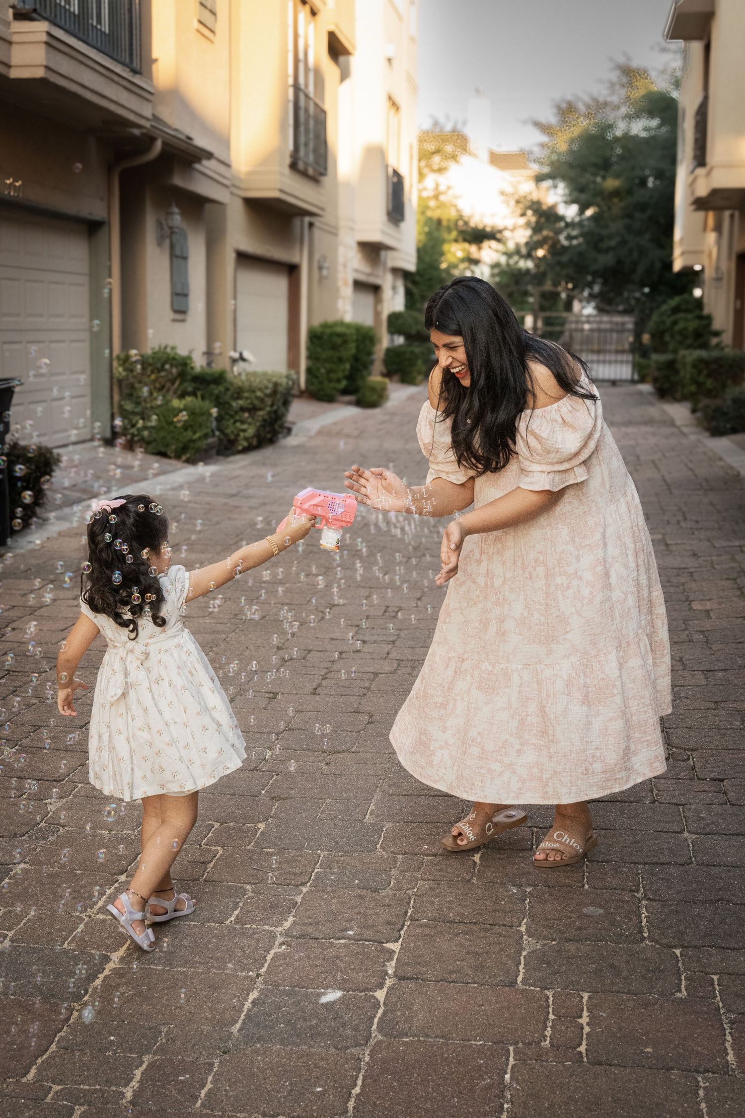 A sweet family moment captured in a series of progressive kissing photos showing affection for a small child.