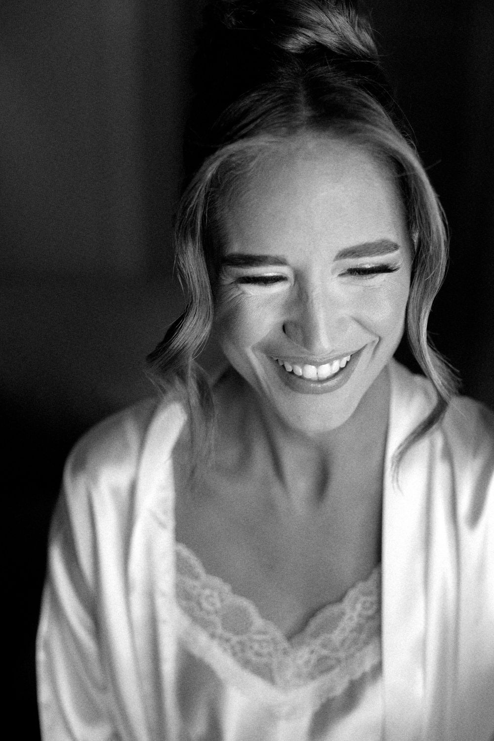 A series of close-up shots showing genuine smiles and joyful expressions in dramatic lighting.