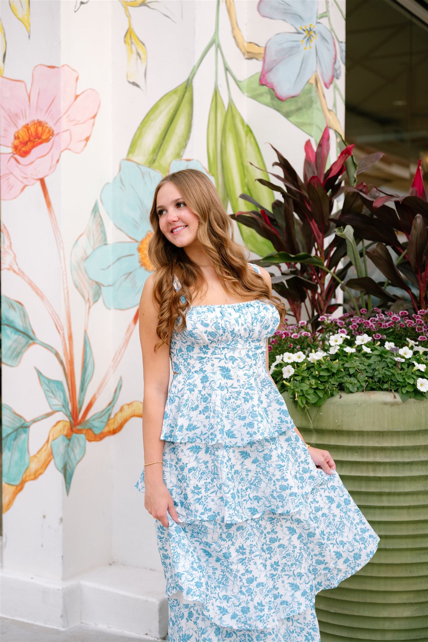 College Park High School girl posing for senior portraits in Market Street of The Woodlands, Texas