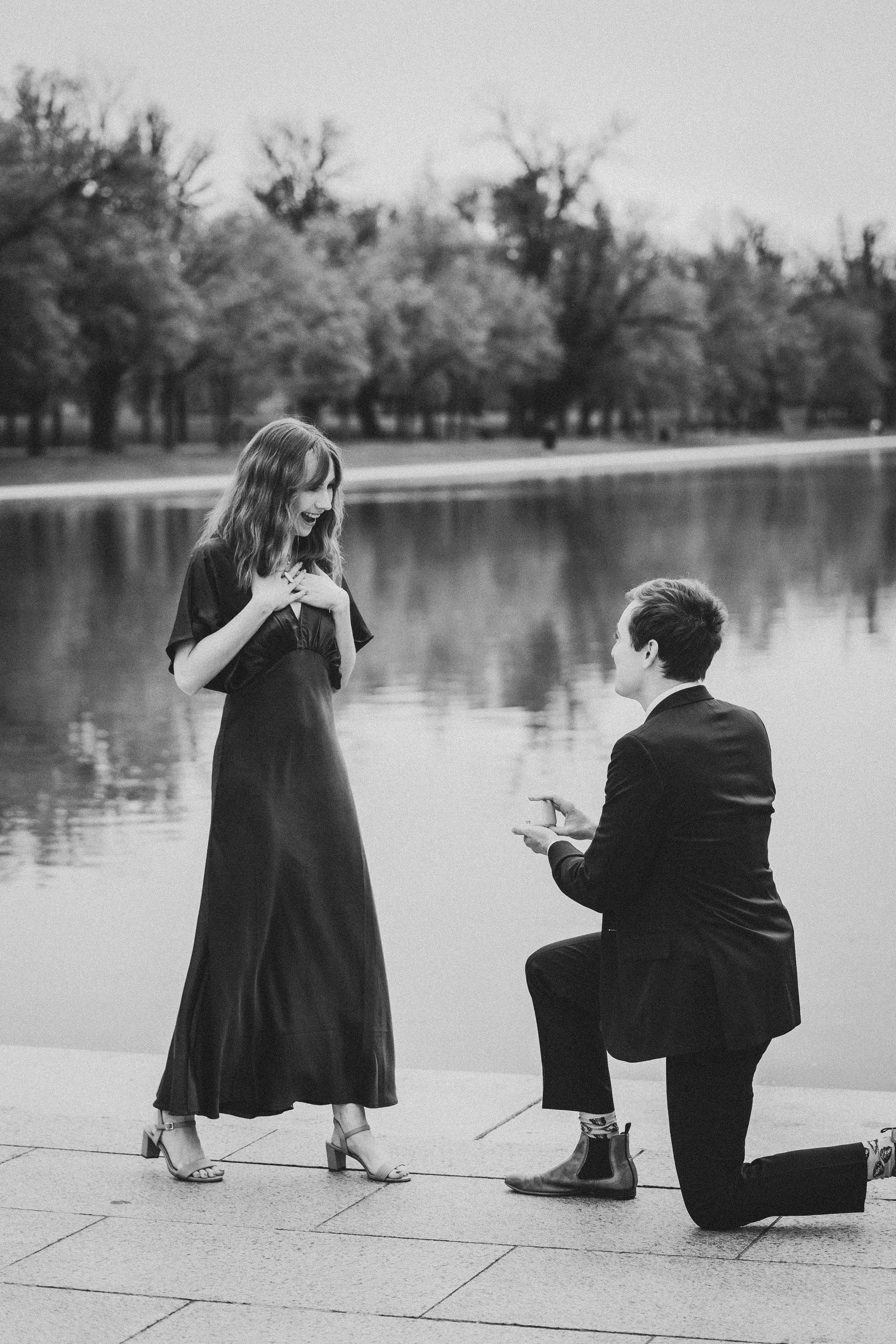 A romantic black and white photo sequence shows a couple sitting by a lake as someone proposes marriage.