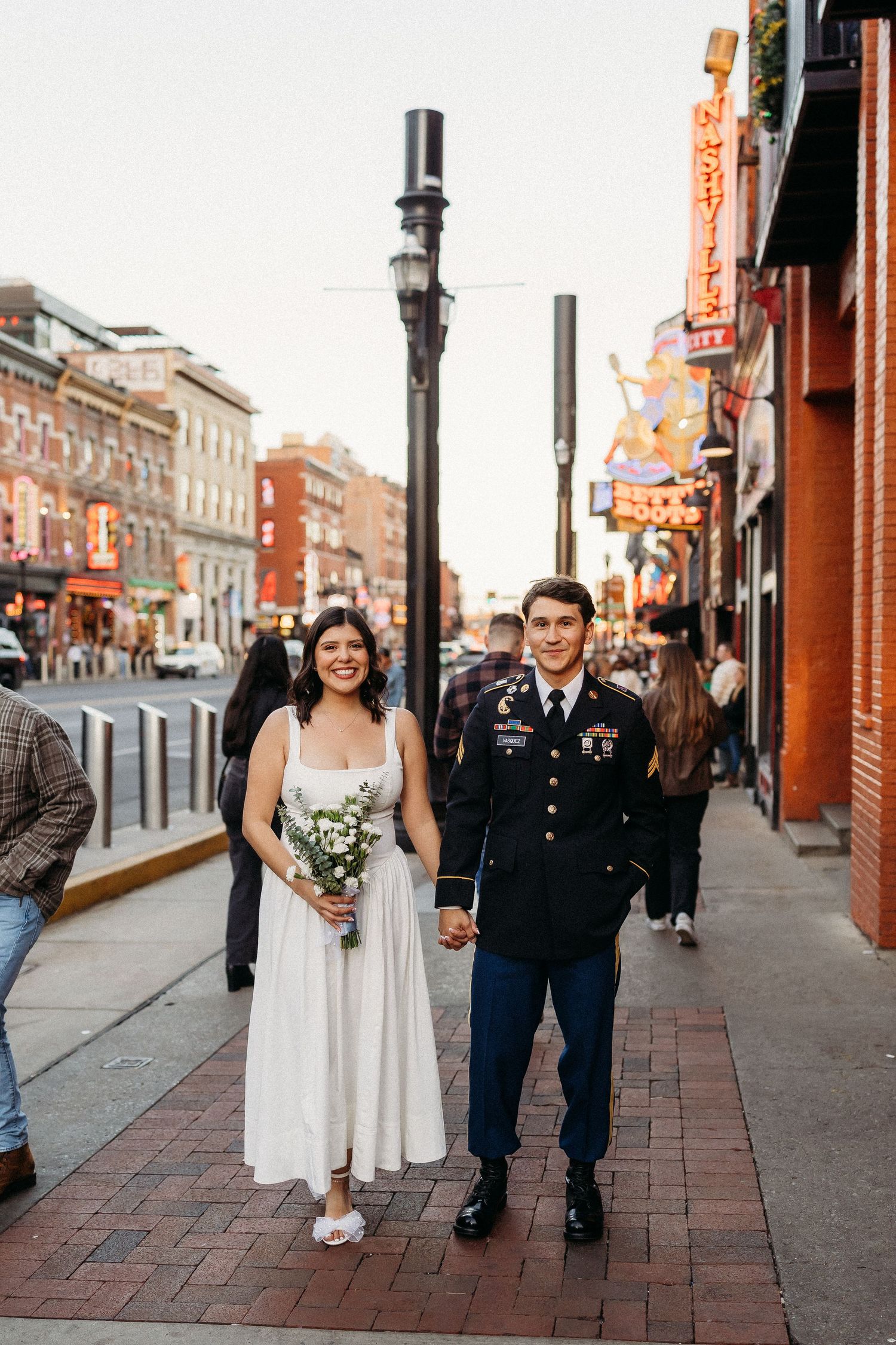 elope Nashville Photographer broadway celebration downtown elopement couple neon lights