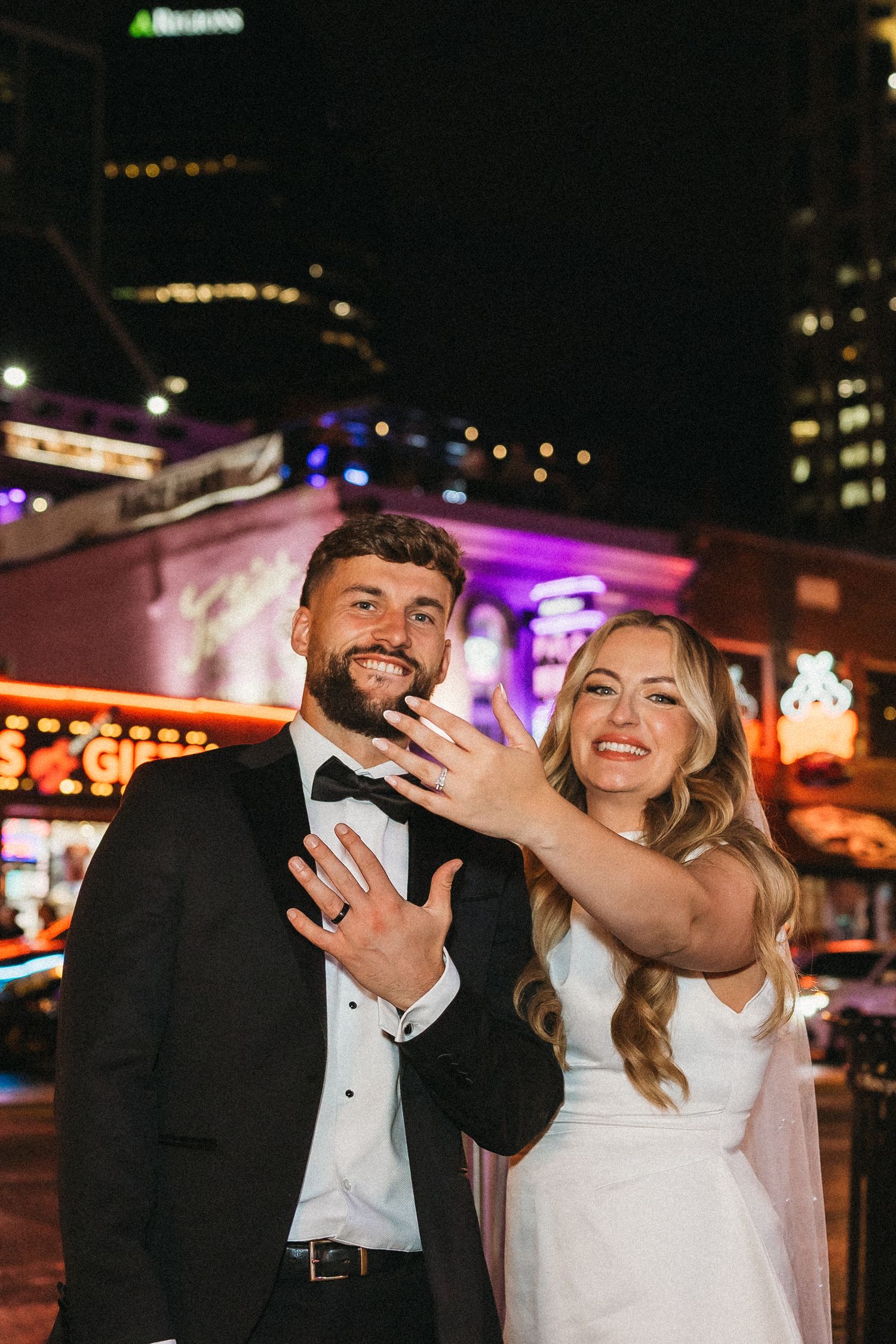 elope Nashville Photographer broadway celebration downtown elopement couple neon lights