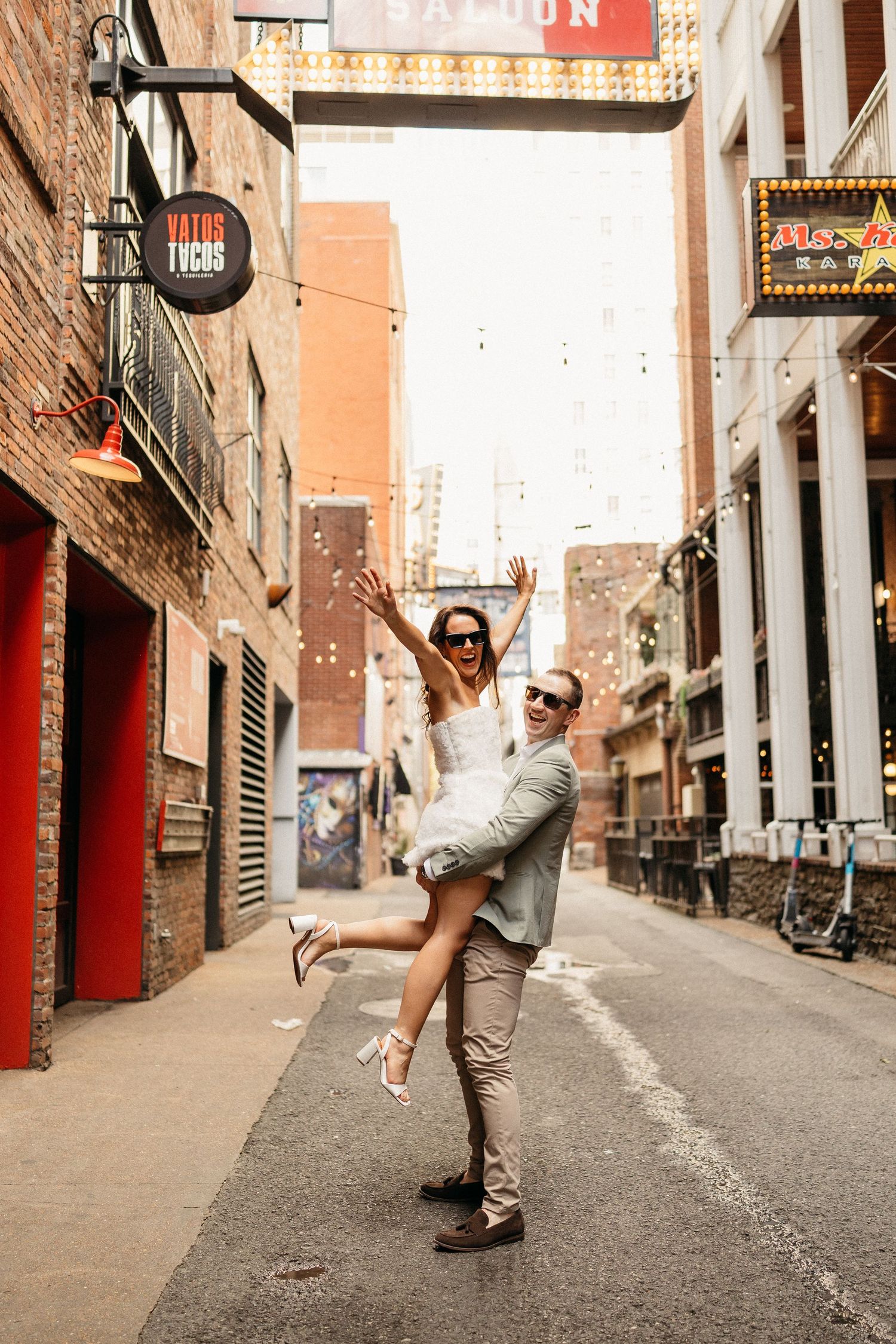 elope Nashville Photographer broadway celebration downtown elopement couple neon lights
