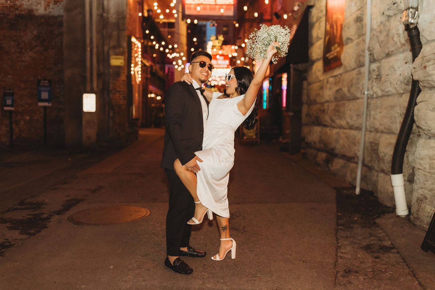 elope Nashville Photographer broadway celebration downtown elopement couple neon lights