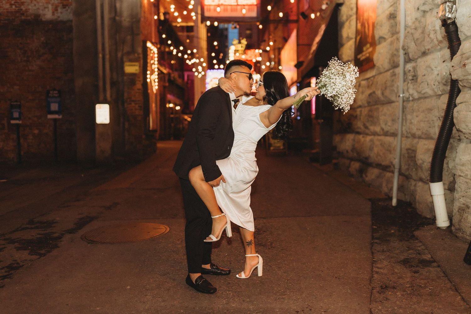 elope Nashville Photographer broadway celebration downtown elopement couple neon lights