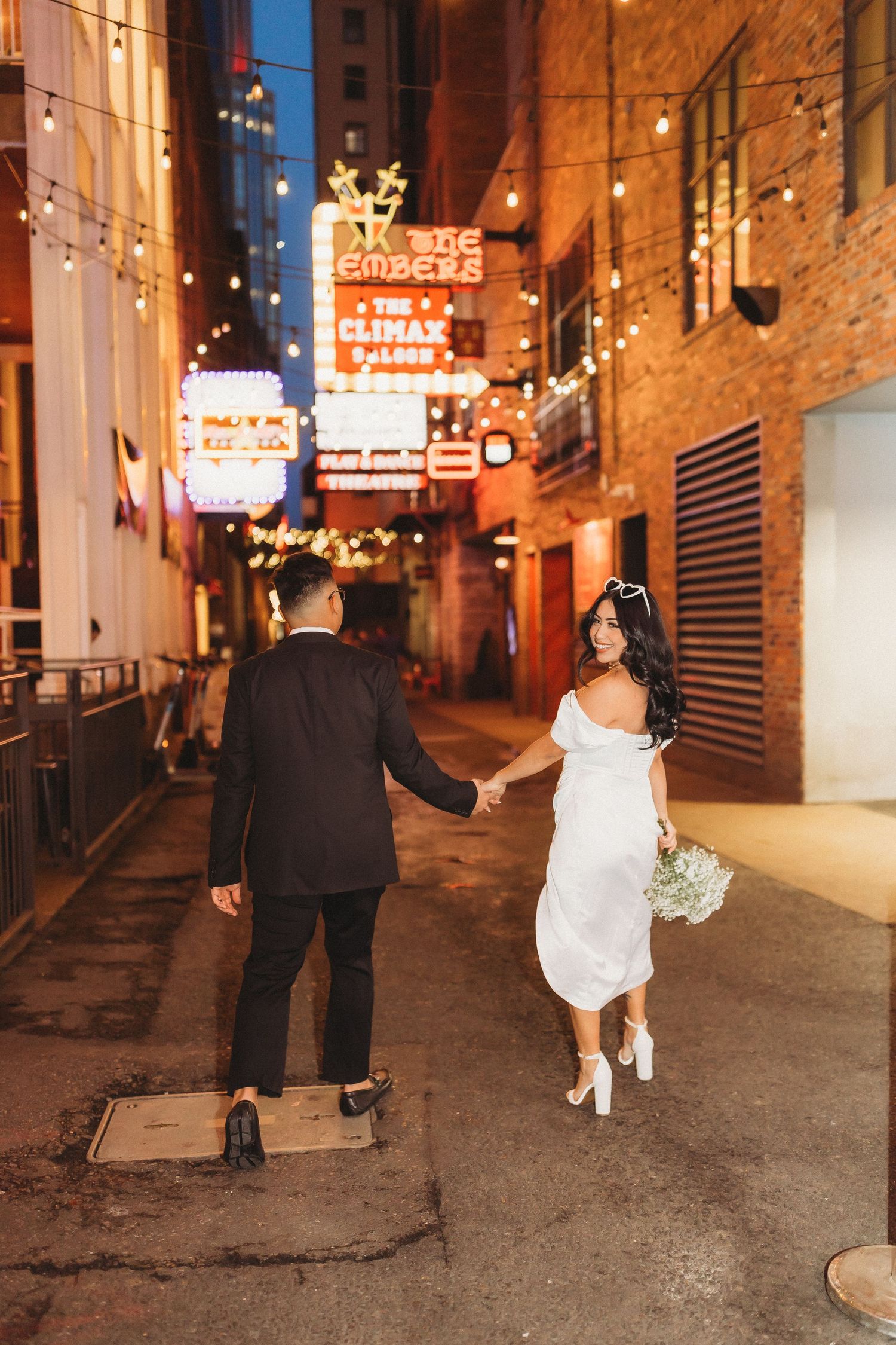 elope Nashville Photographer broadway celebration downtown elopement couple neon lights