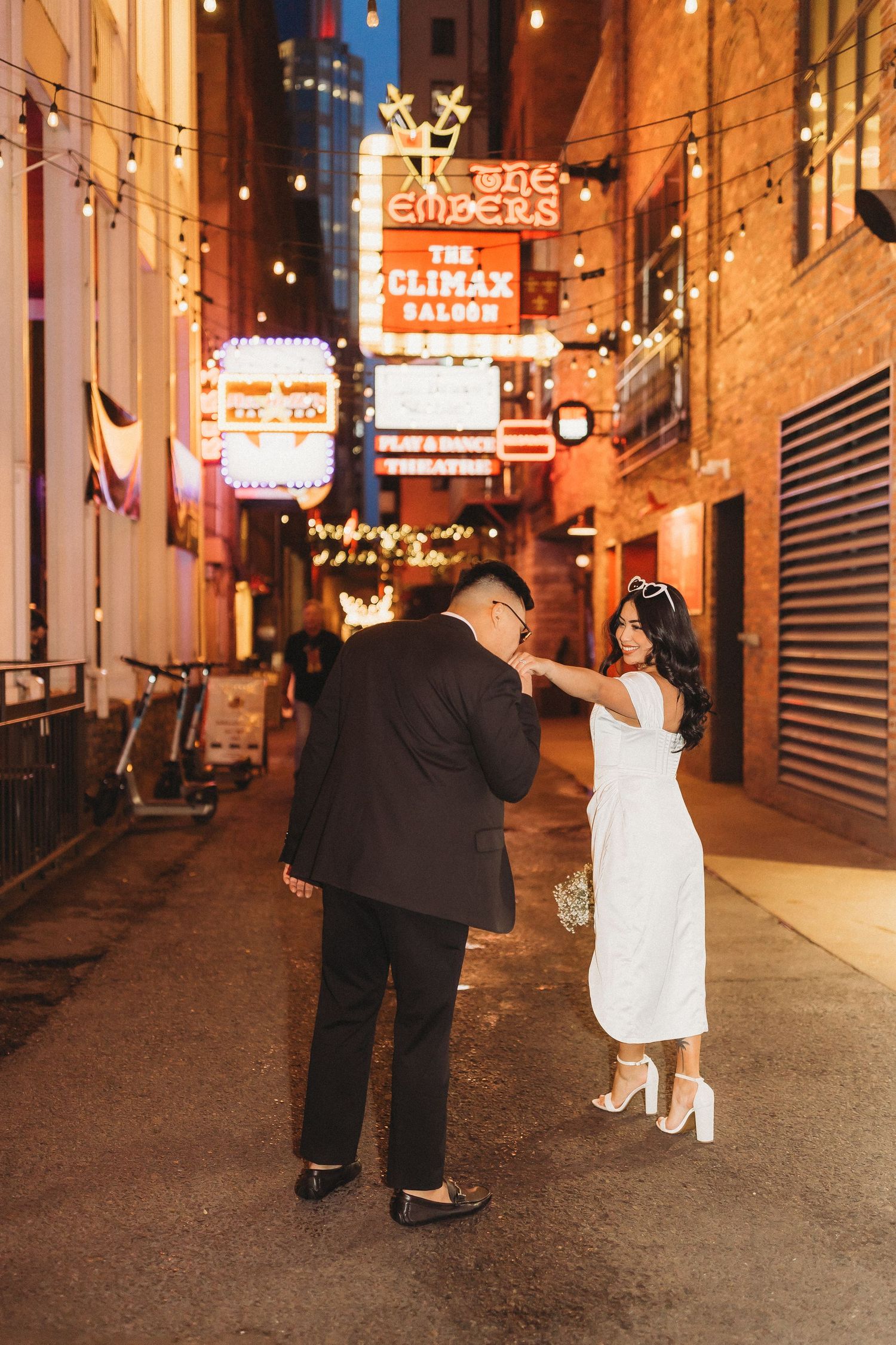elope Nashville Photographer broadway celebration downtown elopement couple neon lights
