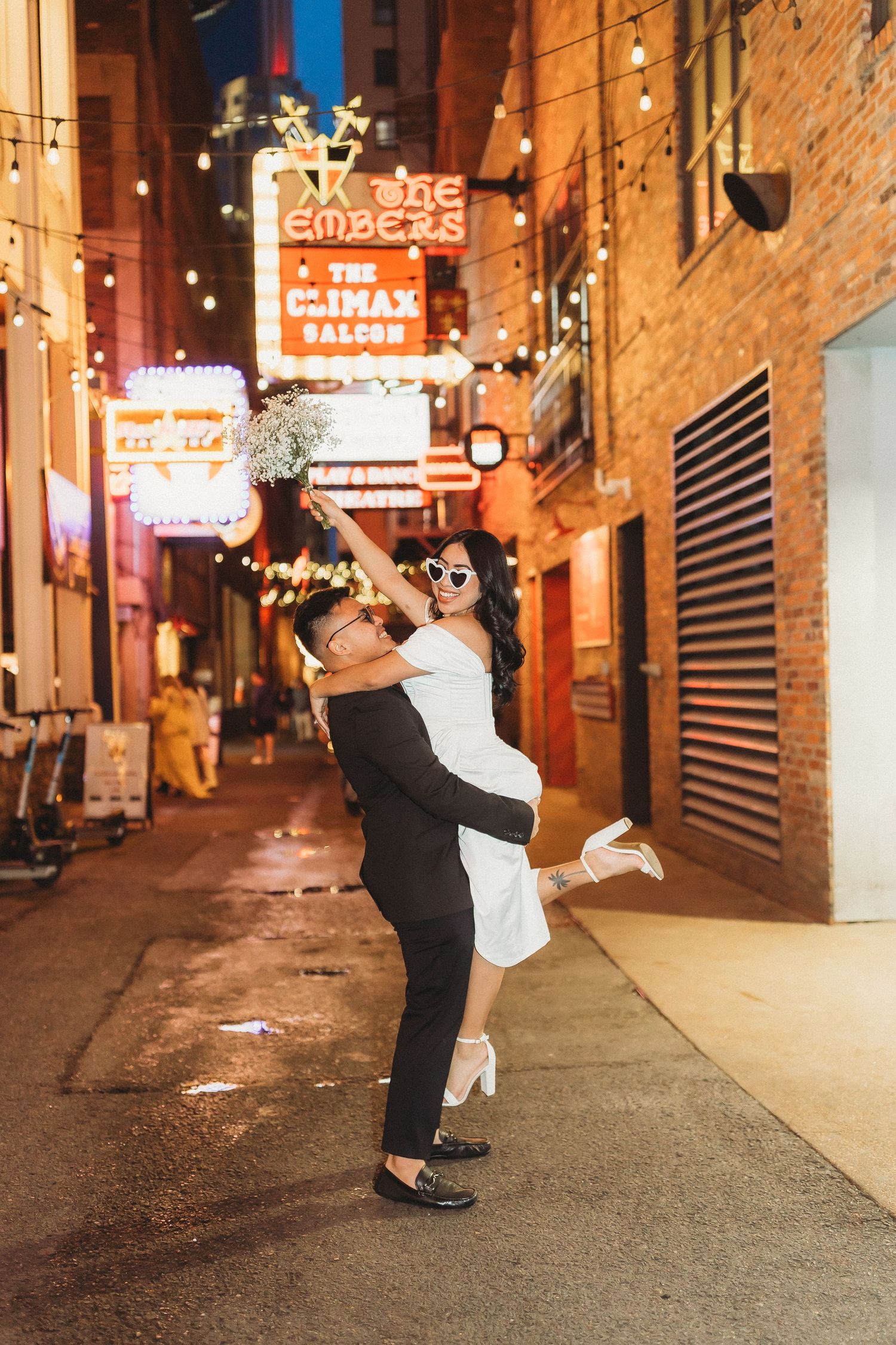 elope Nashville Photographer broadway celebration downtown elopement couple neon lights